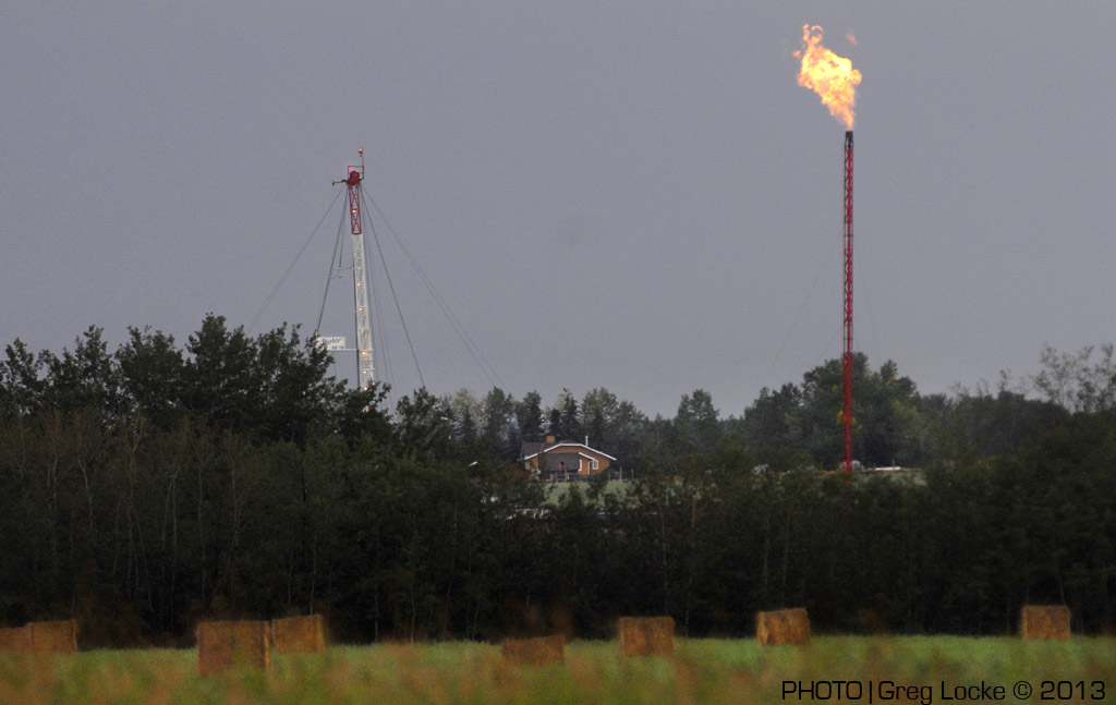 Gas flare from drill rig near a home in Hythe, Alberta, Photo by Greg Locke © 2009 