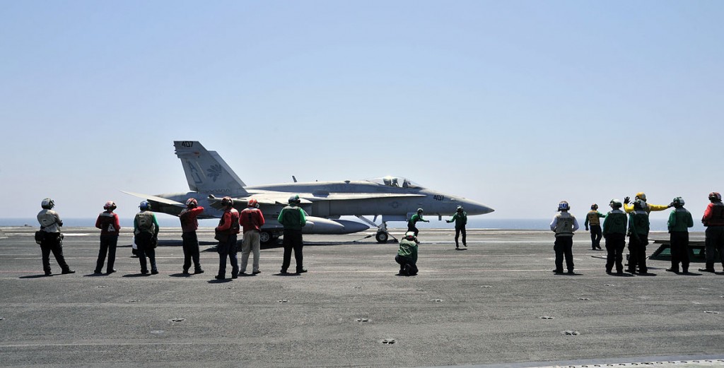 America led the latest intervention in Iraq, starting in January, 2014. Above, U.S. Navy sailors with a F/A-18C Hornet, aboard the aircraft carrier USS George H.W. Bush. U.S. Navy photo by Mass Communication Specialist 3rd Class Margaret Keith