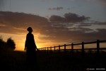 Sister Rachel Denton views the sunset from a vantage point near St Cuthbert's Hermitage in Lincolnshire, north east Britain September 25, 2015. Denton, a Catholic hermit, rises early to tend to her vegetable garden, feed her cats and pray. But the former Carmelite nun, who in 2006 pledged to live the rest of her life in solitude, has another chore - to update her Twitter account and check Facebook. "The myth you often face as a hermit is that you should have a beard and live in a cave. None of which is me," says the ex-teacher. For the modern-day hermit, she says social media is vital: "tweets are rare, but precious," she writes on her Twitter profile. The internet also allows Denton to shop online and communicate with friends. "I am a hermit but I am also human." A diagnosis of cancer earlier this year reaffirmed Denton's wish to carry on a life of solitude, prayer and contemplation. REUTERS/Neil Hall