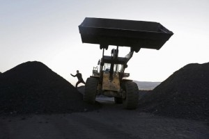 A driver gets off a loading vehicle at local businessman Sun Meng's small coal depot near a coal mine of the state-owned Longmay Group on the outskirts of Jixi, in Heilongjiang province, China, October 23, 2015. To match story CHINA-COAL/JIXI Picture taken on October 23, 2015. REUTERS/Jason Lee TPX IMAGES OF THE DAY