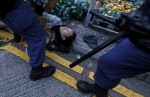 Riot police arrests a protester after a clash at Mongkok district in Hong Kong, China February 9, 2016. REUTERS/Bobby Yip