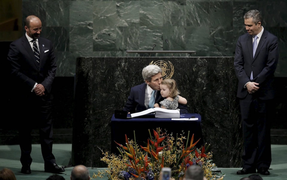 U.S. Secretary of State John Kerry kisses his two-year-old granddaughter Isabelle Dobbs-Higginson after signing the Paris Agreement on climate change at United Nations Headquarters in Manhattan, New York, U.S., April 22, 2016. REUTERS/Mike Segar