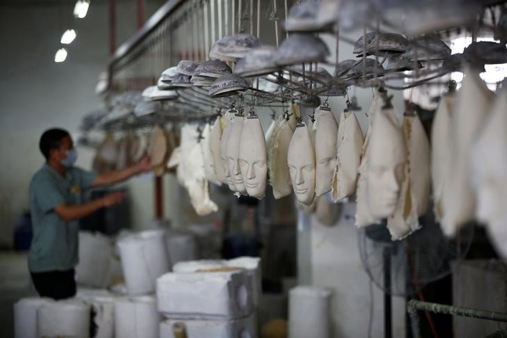 Masks are made at Jinhua Partytime Latex Art and Crafts Factory in Jinhua, Zhejiang Province, China, May 25, 2016. REUTERS/Aly Song 