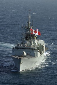 HMCS Toronto flies a Canadian flag in the Arabian Gulf during Operation Altair with the US Navy, a 2004 mission to monitor shipping in the Arabian Gulf. Photo by MCpl Colin Kelley, Canadian Armed Forces