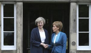 Scotland's First Minister, Nicola Sturgeon (R), greets Britain's new Prime Minister, Theresa May, as she arrives at Bute House in Edinburgh, Scotland, Britain July 15, 2016. REUTERS/Russell Cheyne